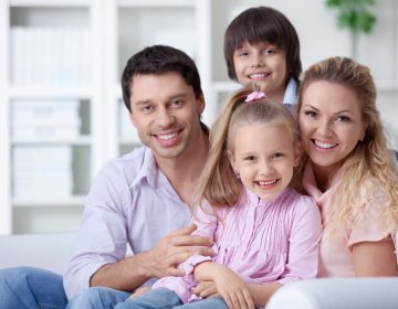 Happy family with children at home